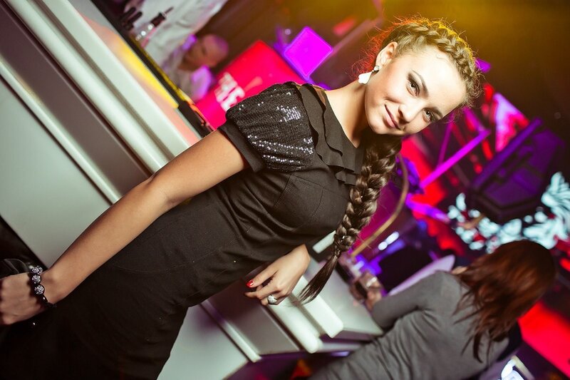 woman in black dress at club
