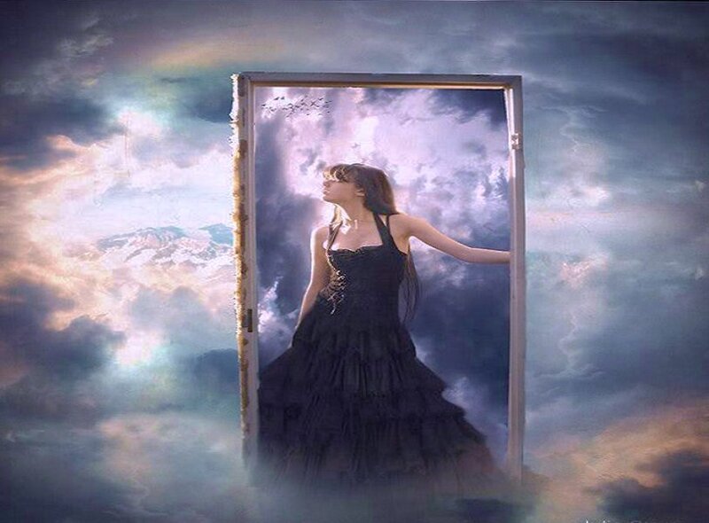 woman in black dress at doorway