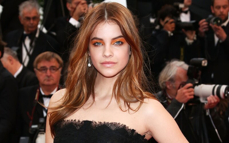 woman in black dress at event
