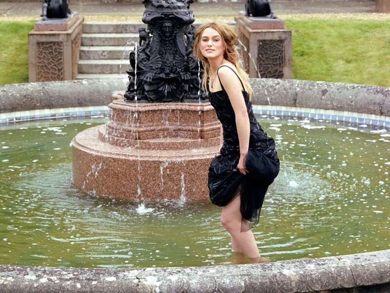 Woman in black dress at fountain