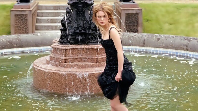 Woman in black dress at fountain