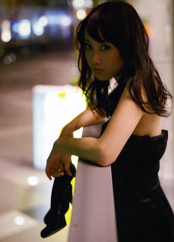 woman in black dress at night