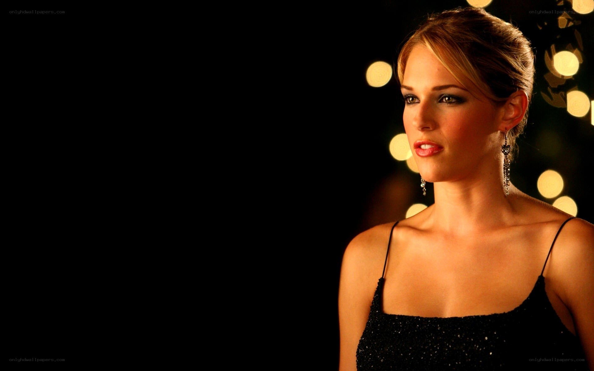 woman in black dress at night