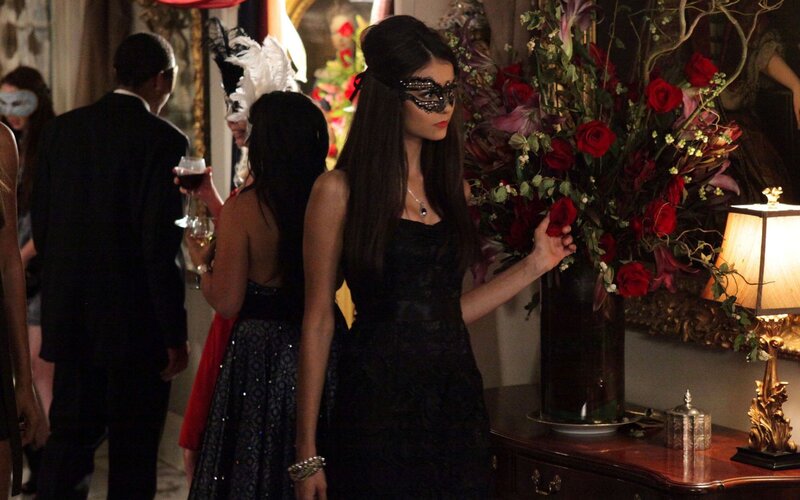 Woman in black dress at party