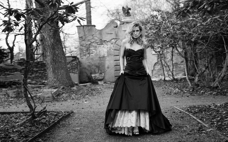 woman in black dress at ruins