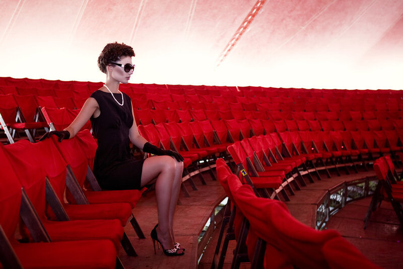 Woman in black dress at theater