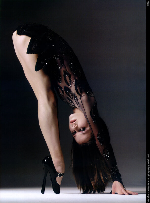 woman in black dress bending
