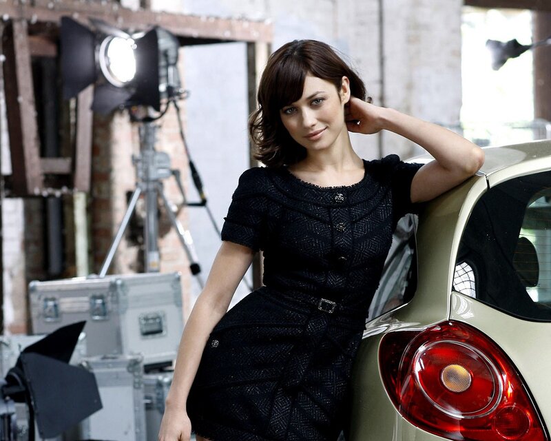 woman in black dress by car