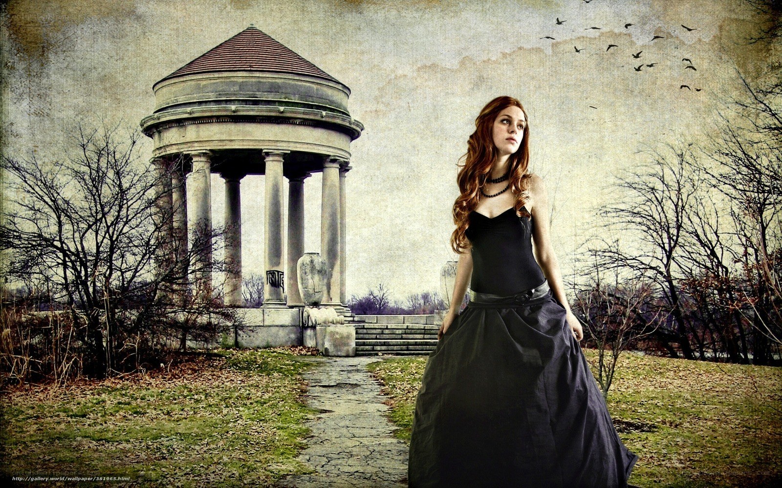 Woman in black dress by gazebo