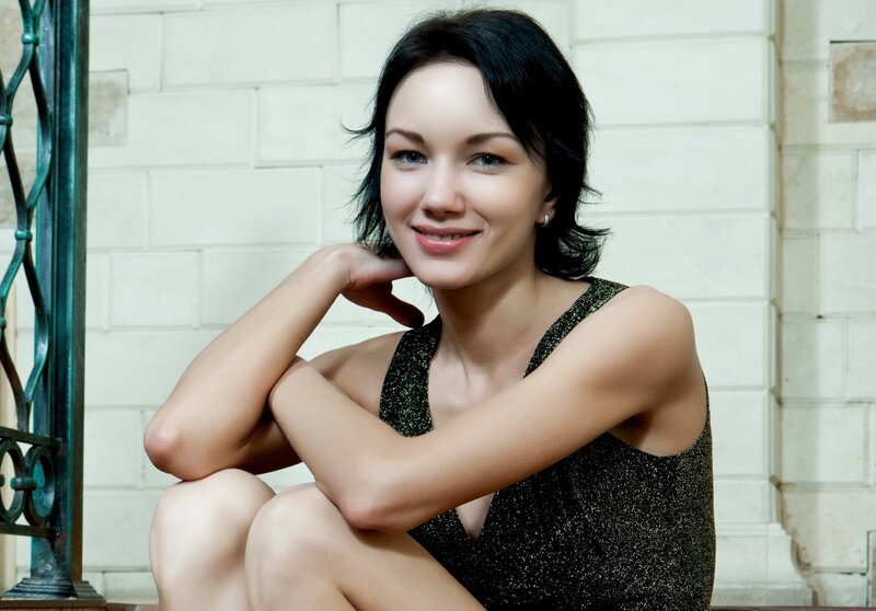 Woman in Black Dress — Calm, Photograph, Brick Wall