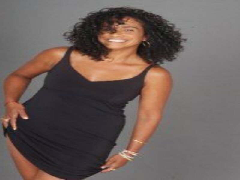 Woman in Black Dress — Confident, Photograph, Curly Hair