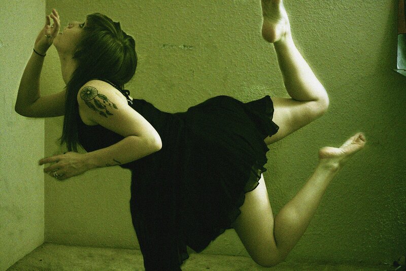 woman in black dress dancing