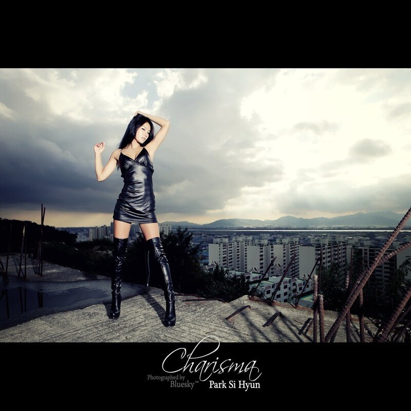 Woman in Black Dress — Dramatic, Afternoon, Photograph, Cityscape, Mountains