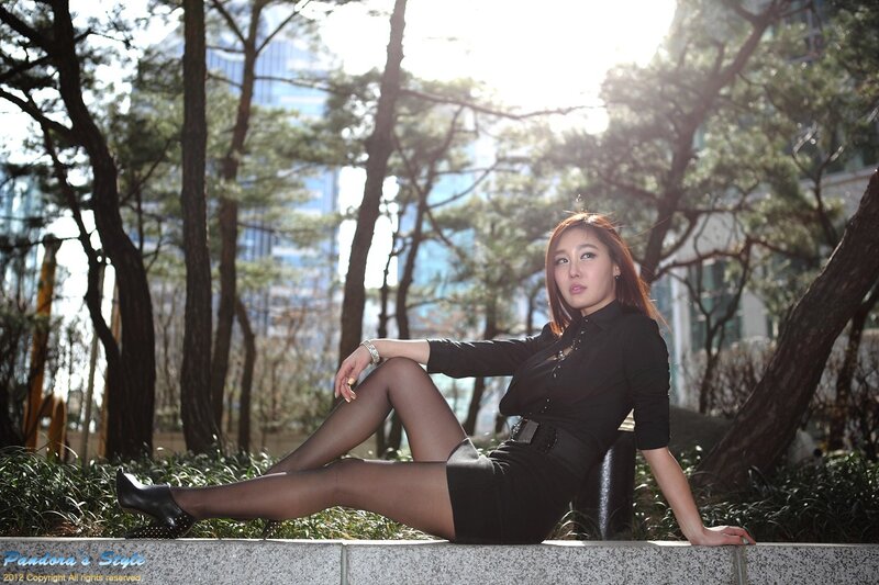 Woman in Black Dress — Dramatic, Afternoon, Photograph, Trees, Skyscraper