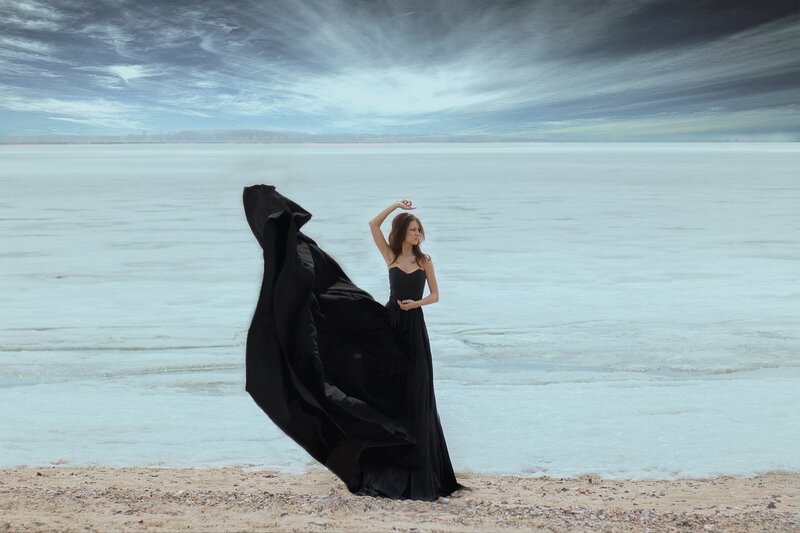 Woman in Black Dress — Dramatic, Photograph, Beach, Sky
