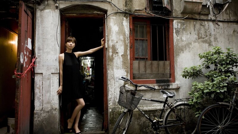 Woman in Black Dress — Dramatic, Photograph, Bicycle