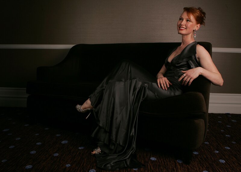 Woman in Black Dress — Dramatic, Photograph, Couch, Earrings