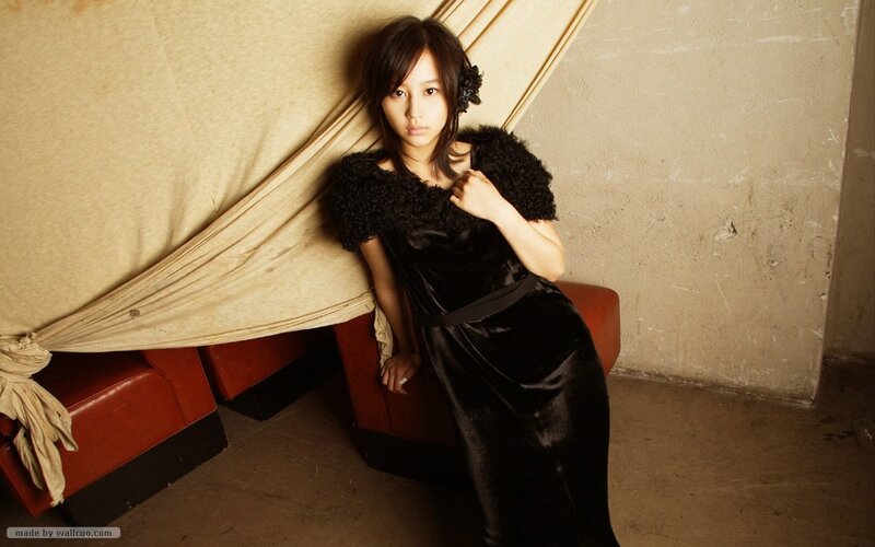 Woman in Black Dress — Dramatic, Photograph, Couch, Wall, Beige