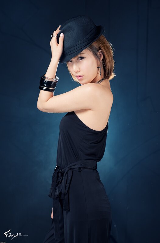 Woman in Black Dress — Dramatic, Photograph, Hat, Bracelet