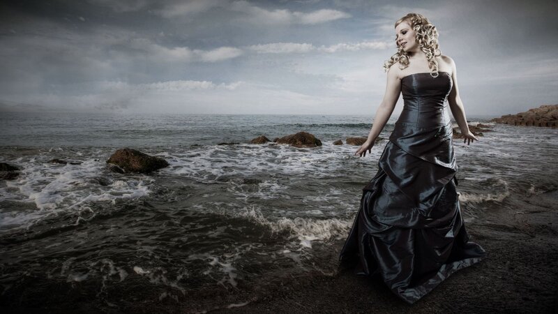 Woman in Black Dress — Dramatic, Photograph, Ocean, Rocks