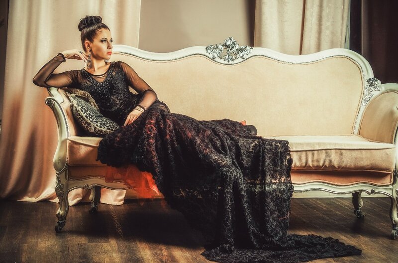 Woman in Black Dress — Dramatic, Photograph, Sofa