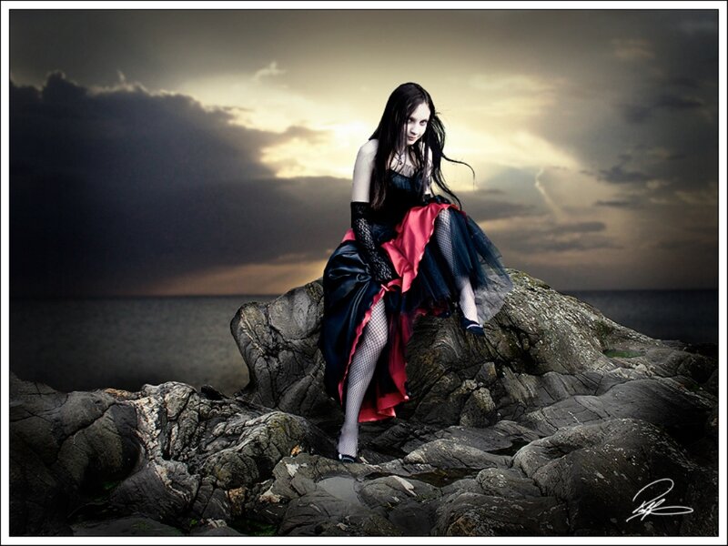 Woman in Black Dress — Dramatic, Sunset, Photograph, Rocks