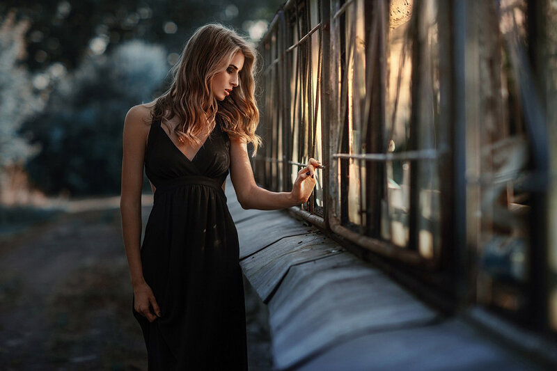 Woman in Black Dress — Dramatic, Sunset, Photograph, Train Car