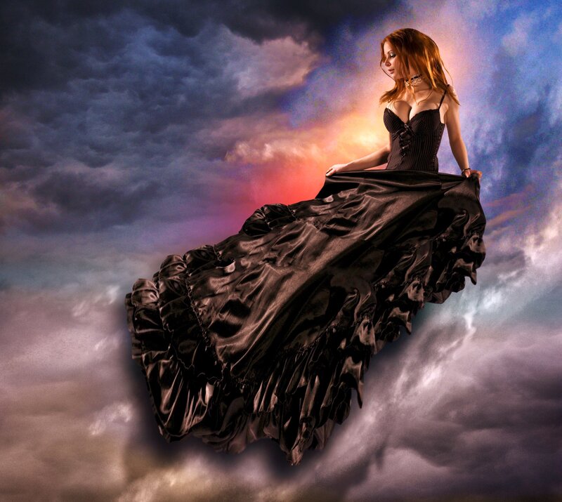 woman in black dress floating