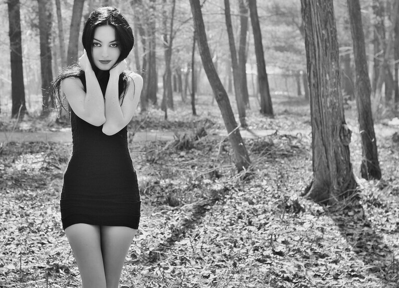 woman in black dress in forest
