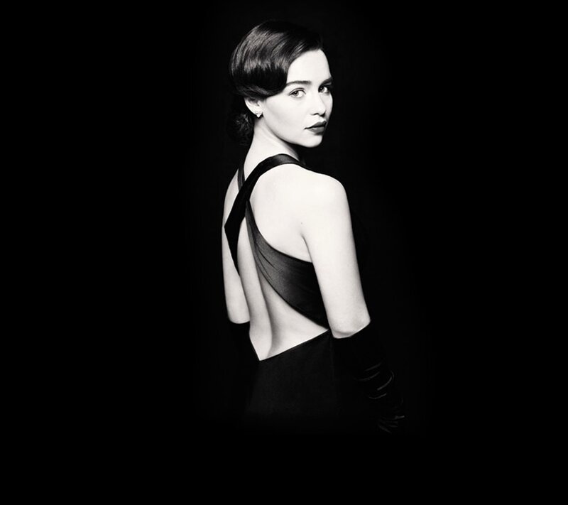 woman in black dress looking back