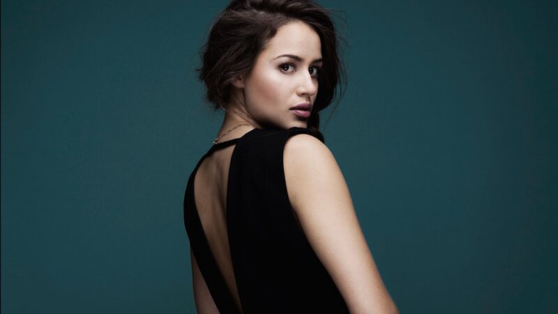woman in black dress looking back