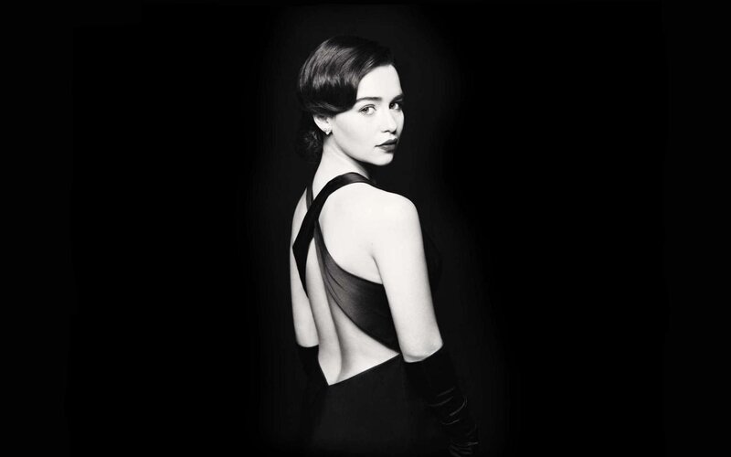 woman in black dress looking back