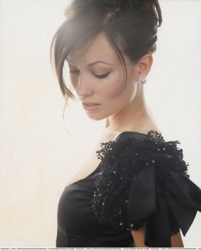 woman in black dress looking down