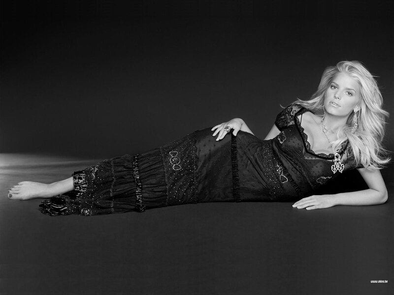 woman in black dress lying down