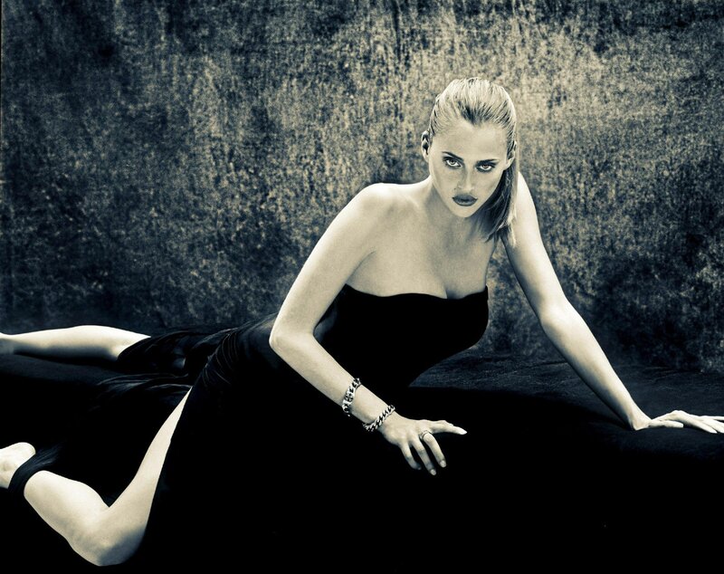 woman in black dress lying down