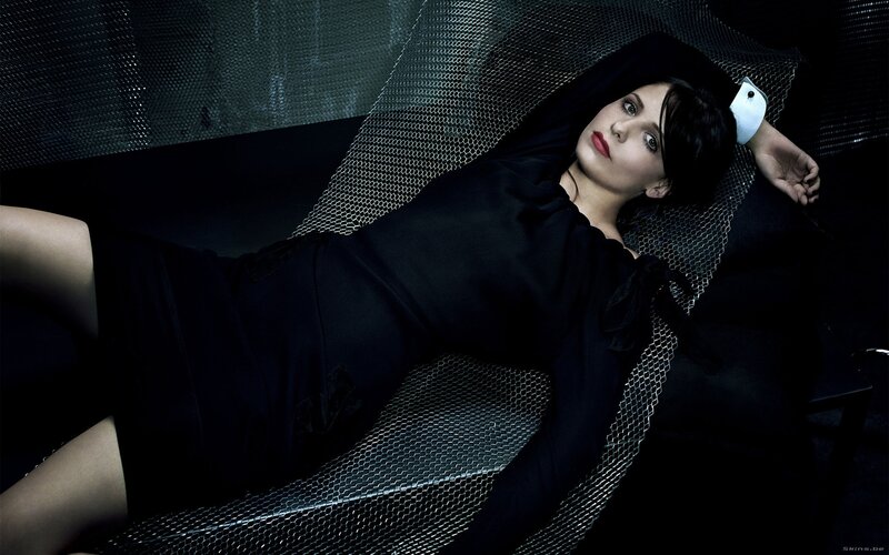 woman in black dress lying down
