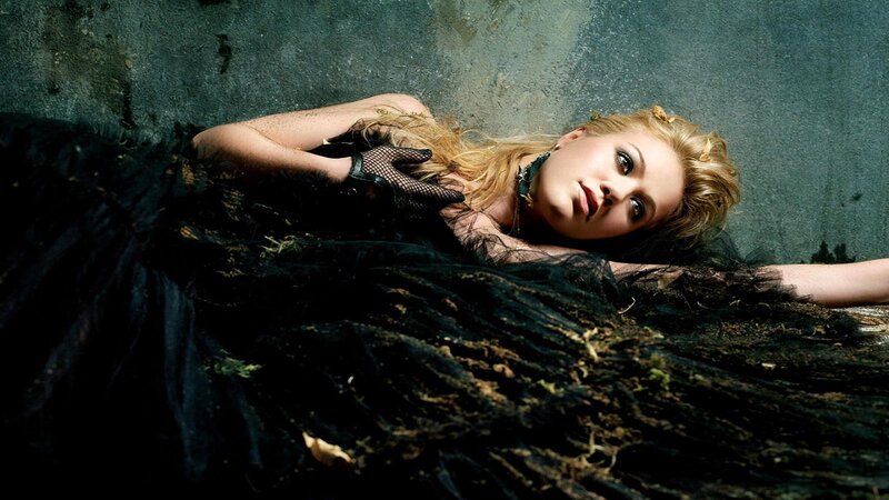 woman in black dress lying down
