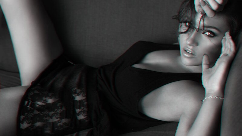 woman in black dress lying down