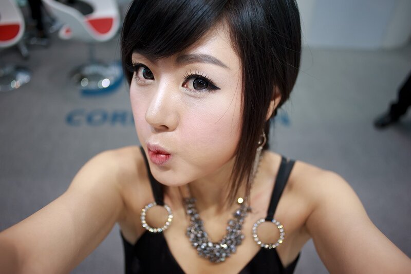 woman in black dress making a face