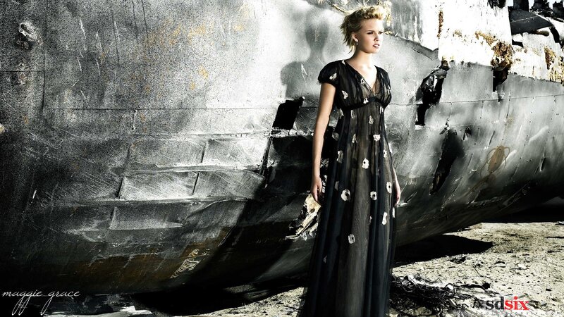 woman in black dress near wreckage