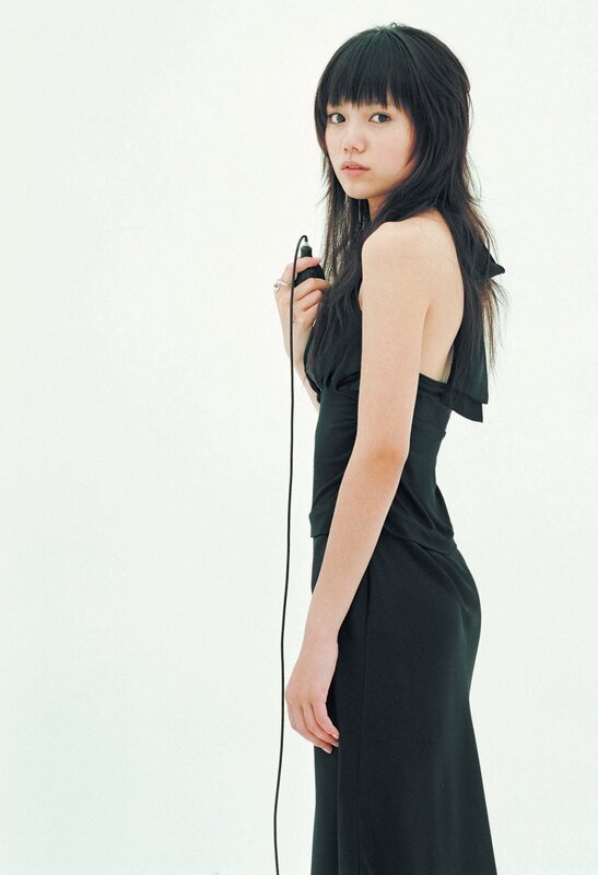 Woman in Black Dress — Neutral, Photograph, Microphone