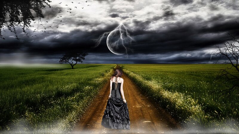 Woman in black dress on a path