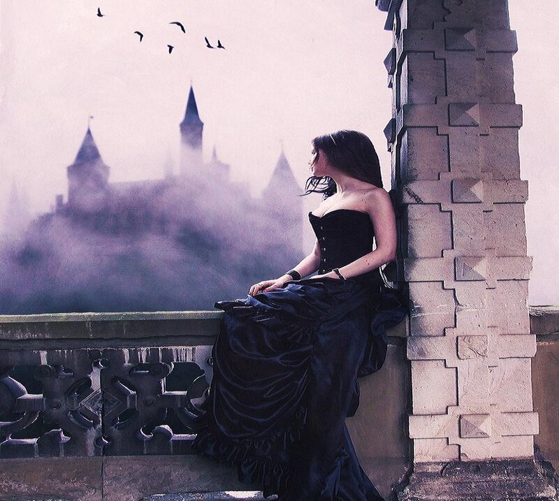 woman in black dress on balcony