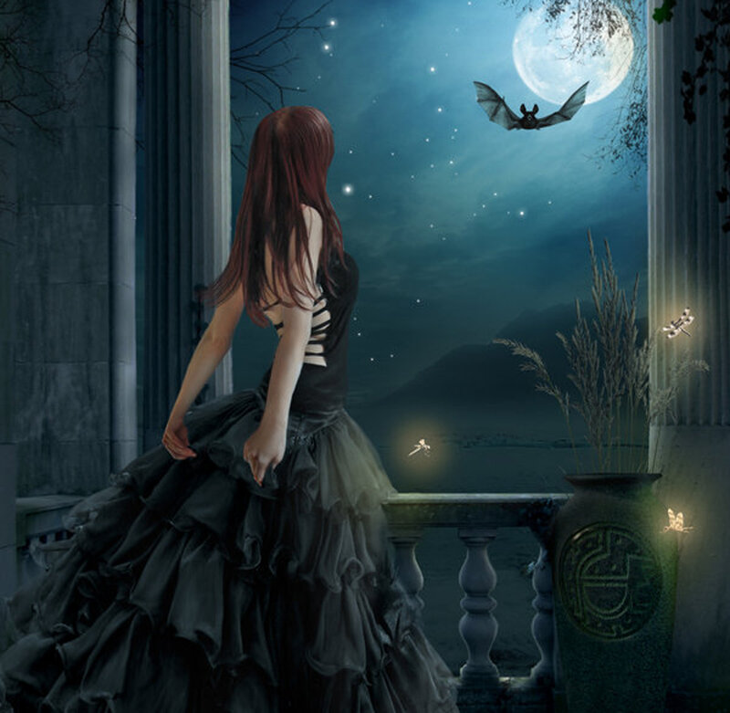 Woman in black dress on balcony