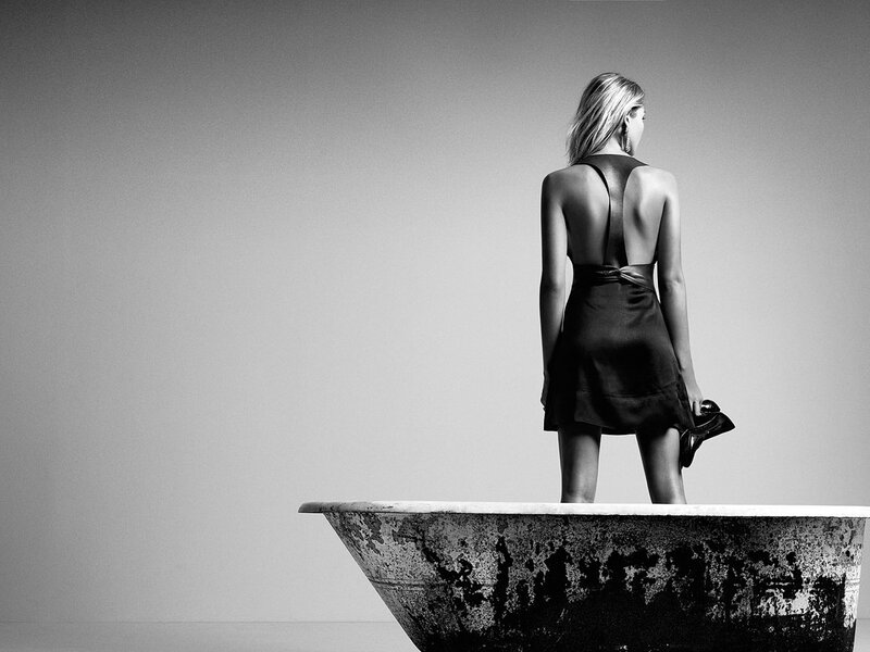 woman in black dress on bathtub