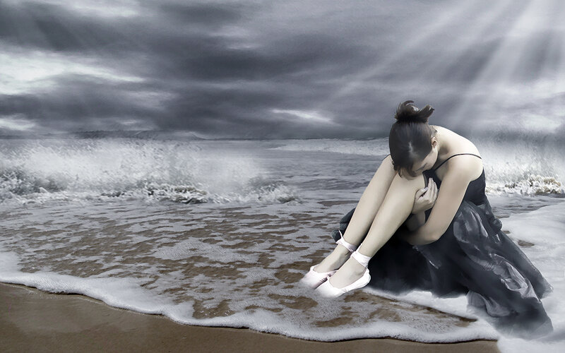 woman in black dress on beach