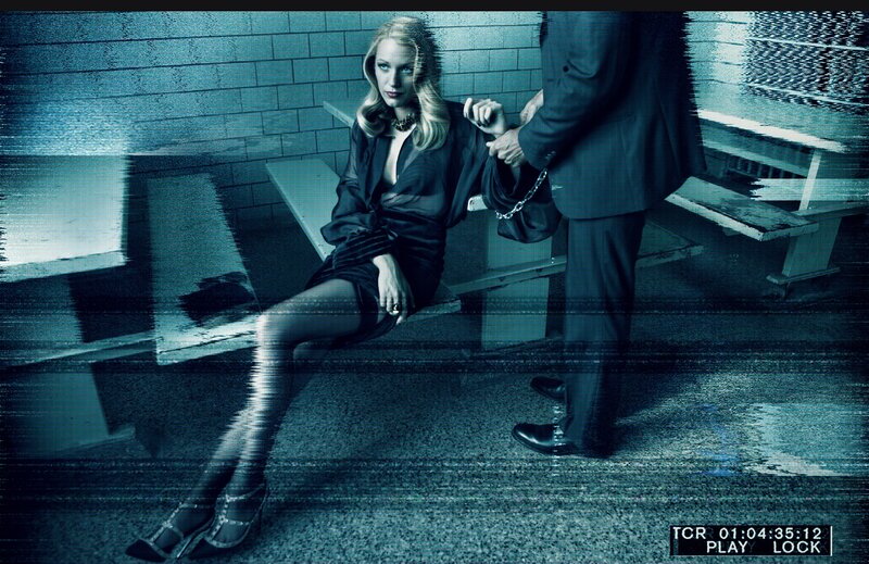 woman in black dress on bench