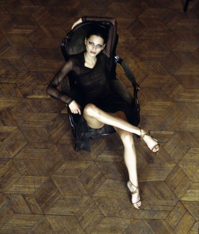 woman in black dress on chair