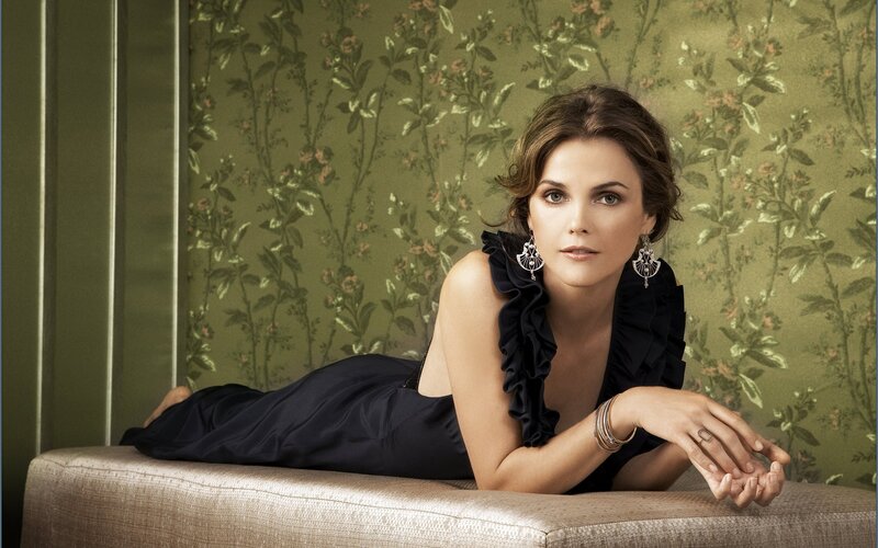 woman in black dress on chaise