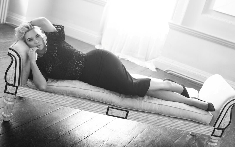 woman in black dress on chaise lounge